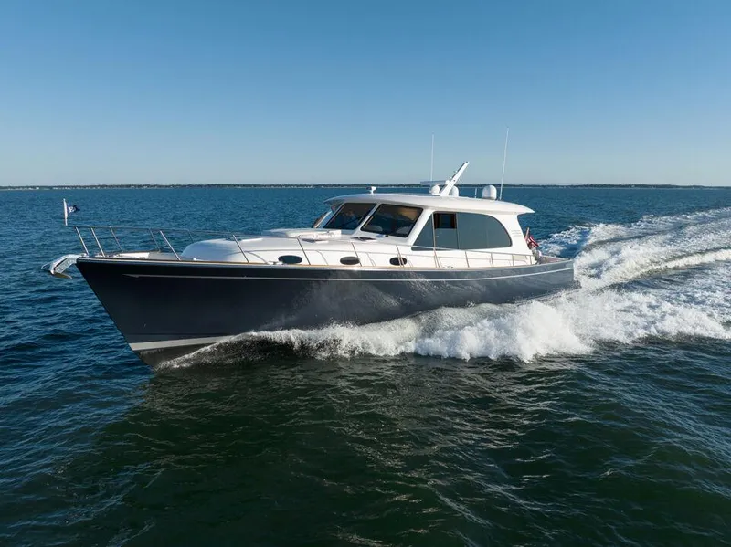 Slide: The Image of 2025 Eastbay EB60 yacht cruising on open water. - 9