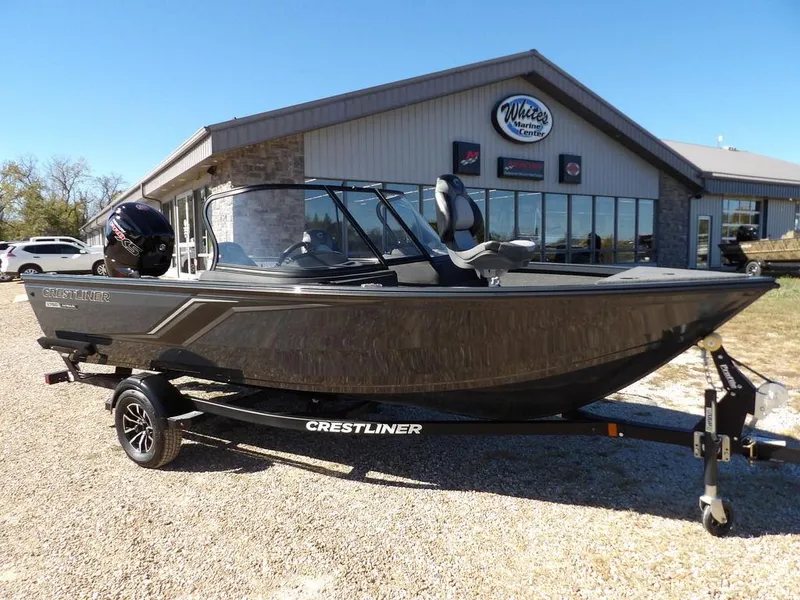 The Image of 2025 Crestliner 1750 Hawk Walk Through boat on trailer outside dealership. - 0