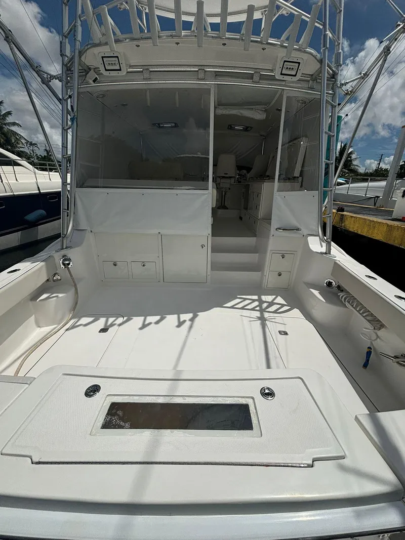 Slide: The Image of 2006 Luhrs 41 Open boat with spacious deck and fishing amenities. - 10