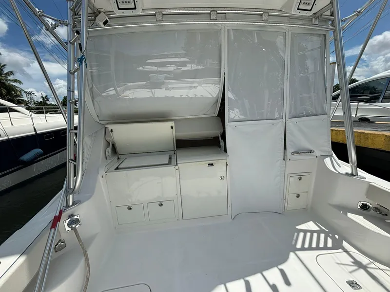 Slide: The Image of 2006 Luhrs 41 Open boat interior with storage compartments and clean white finish. - 11