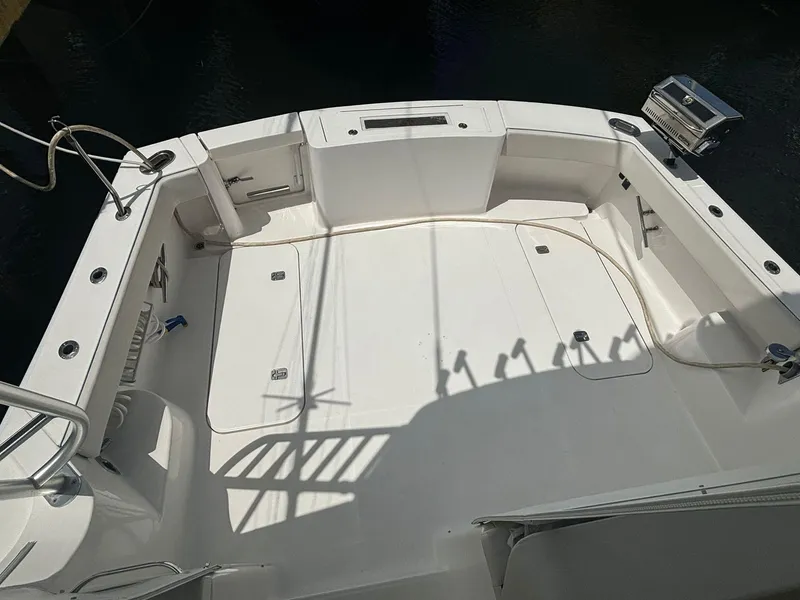 Slide: The Image of 2006 Luhrs 41 Open boat deck, spacious and clean, with fishing rod holders. - 13