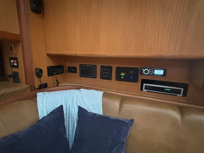 Slide: The Image of Interior of 2006 Luhrs 41 Open yacht with control panels and seating area. - 19