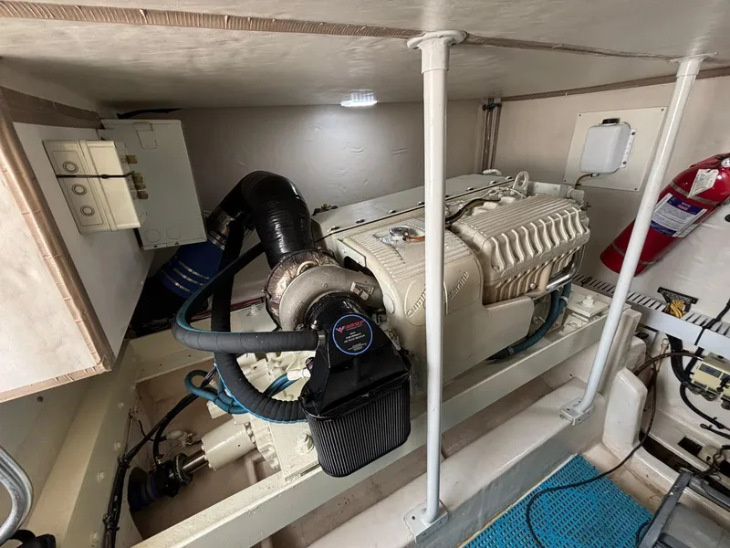 Slide: The Image of Engine room of 2006 Luhrs 41 Open boat, featuring a well-maintained engine and equipment. - 27