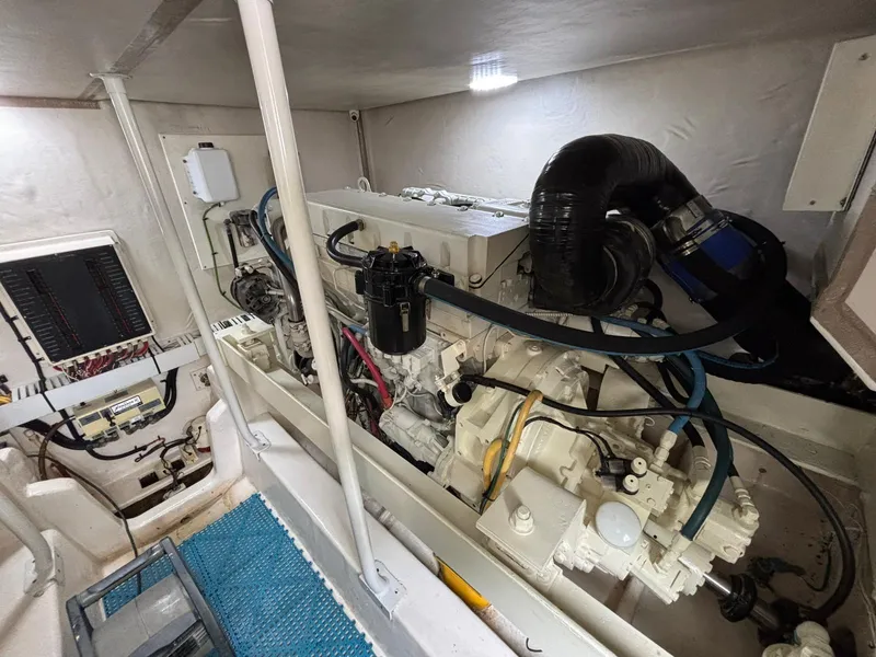 Slide: The Image of Engine room of 2006 Luhrs 41 Open boat, showcasing detailed mechanical components. - 30