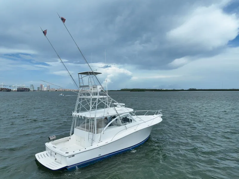 Slide: The Image of 2006 Luhrs 41 Open yacht on open water under cloudy sky. - 6