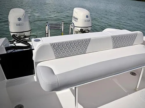 Slide: The Image of 2025 Twin Vee 240 GFX DC boat with Suzuki engines, featuring stylish seating. - 10