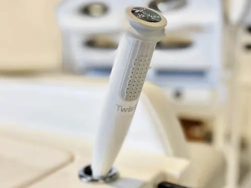 Slide: The Image of Close-up of a 2025 Twin Vee 240 GFX DC boat control lever. - 11