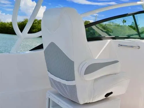 Slide: The Image of Luxury seating on 2025 Twin Vee 240 GFX DC boat, featuring sleek white design. - 18