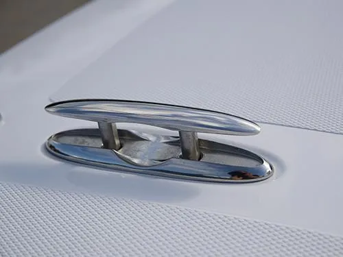 Slide: The Image of Close-up of a 2025 Twin Vee 240 GFX DC boat cleat on a textured surface. - 28