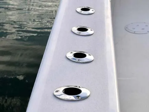 Slide: The Image of Twin Vee 240 GFX DC 2025 boat rod holders on deck by water. - 9