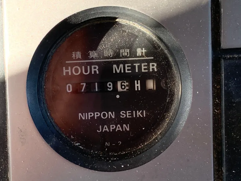 Slide: The Image of Nippon Seiki hour meter displaying 7196 hours. - 11