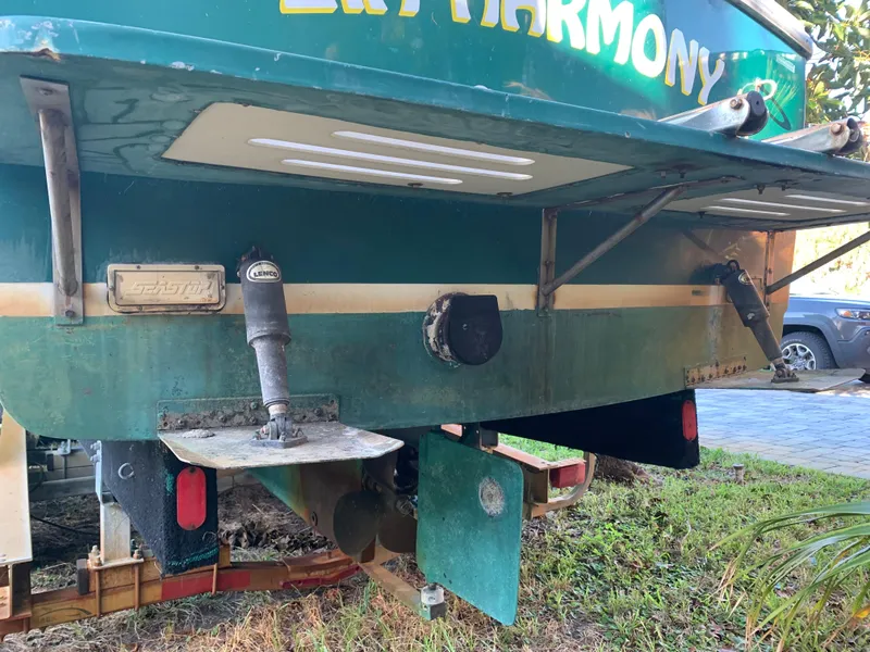 Slide: The Image of Rear view of a 1998 Atlas Acadia boat on a trailer. - 13