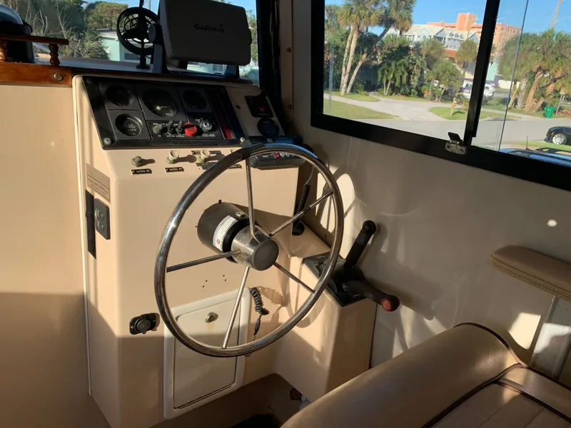 Slide: The Image of Interior of a 1998 Atlas Acadia with steering wheel and controls. - 3