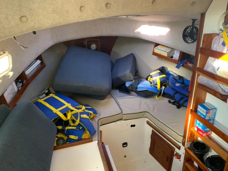 Slide: The Image of Interior of a 1998 Atlas Acadia with life jackets and cushions. - 4
