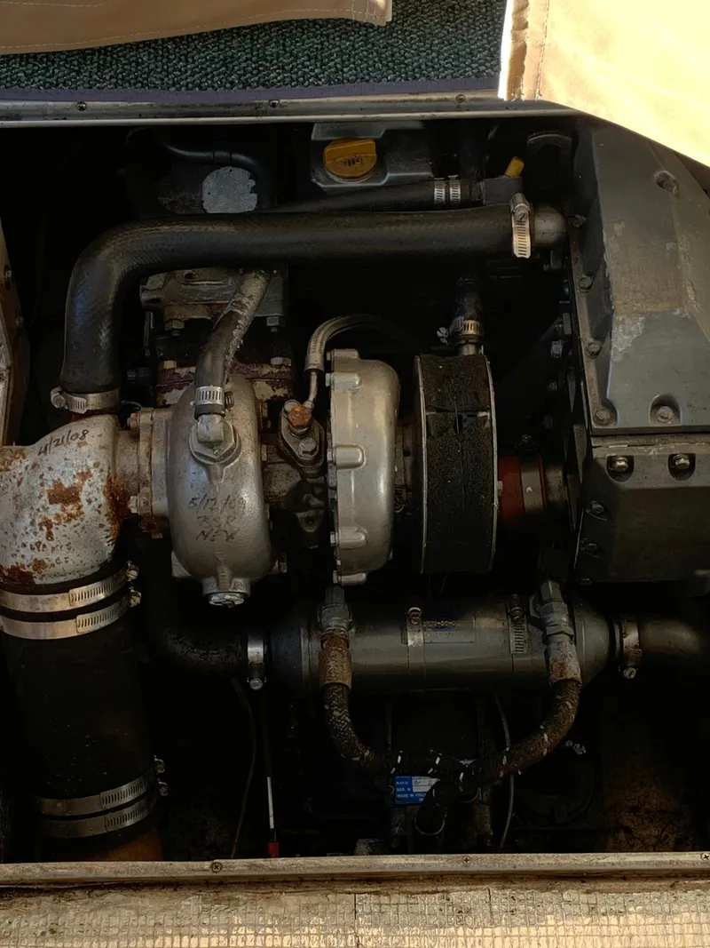 Slide: The Image of Engine compartment of a 1998 Atlas Acadia with visible components. - 9