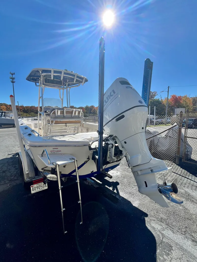 Slide: The Image of 2023 Sea Chaser 23 LX boat with outboard motor under bright sun. - 5