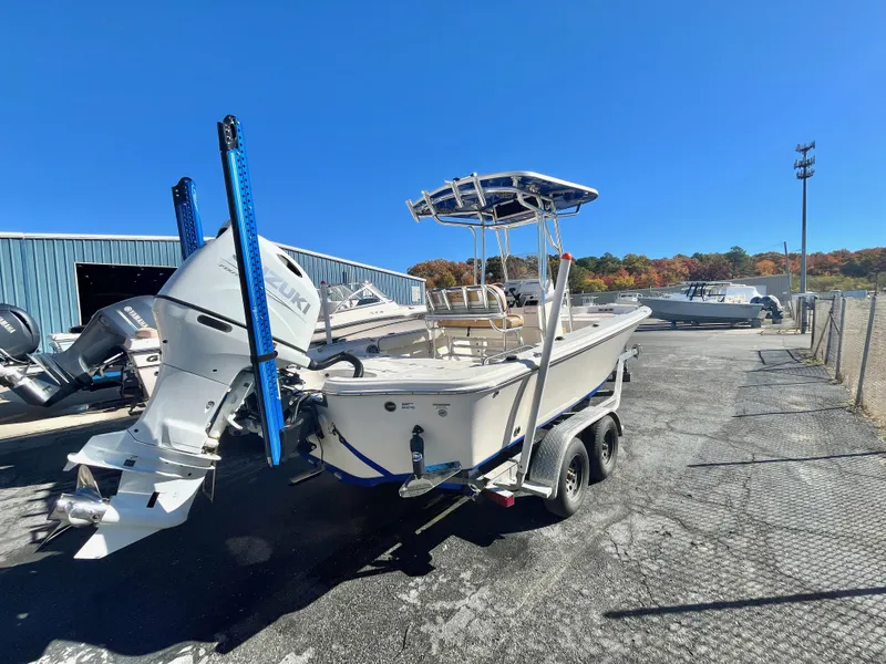 Slide: The Image of 2023 Sea Chaser 23 LX boat on trailer in sunny outdoor setting. - 6