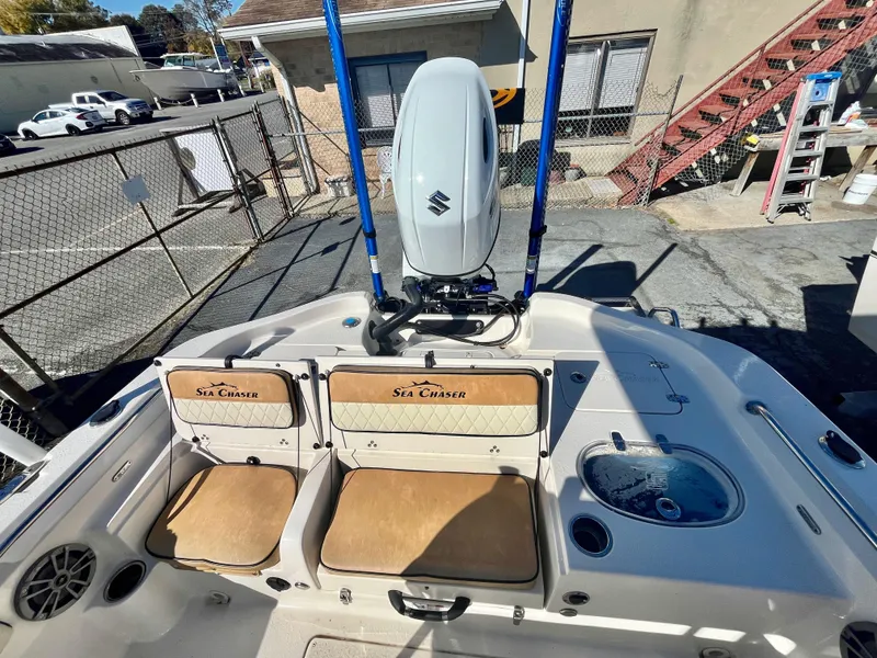 Slide: The Image of 2023 Sea Chaser 23 LX boat interior with seating and motor. - 9