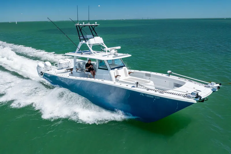 Slide: The Image of Freeman 43 boat cruising on open water, 2023 model, blue hull, sunny day. - 11