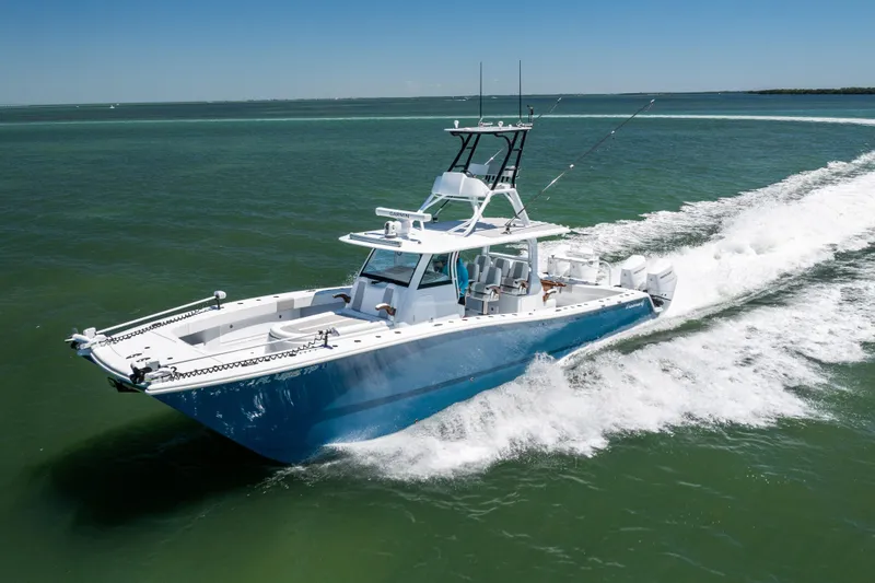 Slide: The Image of 2023 Freeman 43 boat cruising on open water, showcasing sleek design and performance. - 12