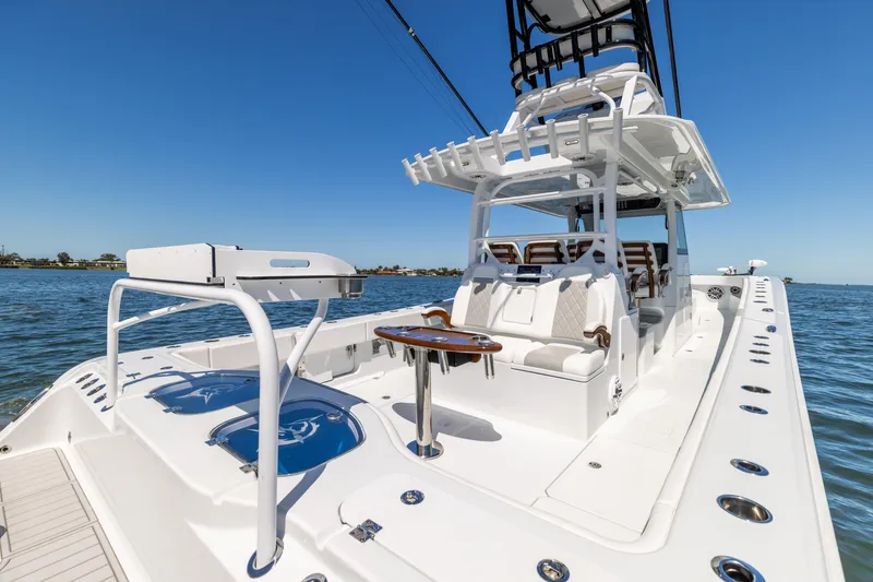 Slide: The Image of 2023 Freeman 43 boat with spacious deck and seating on open water. - 19