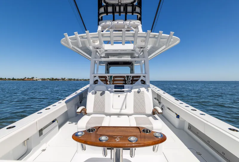 Slide: The Image of 2023 Freeman 43 boat on open water, featuring sleek design and spacious deck. - 21