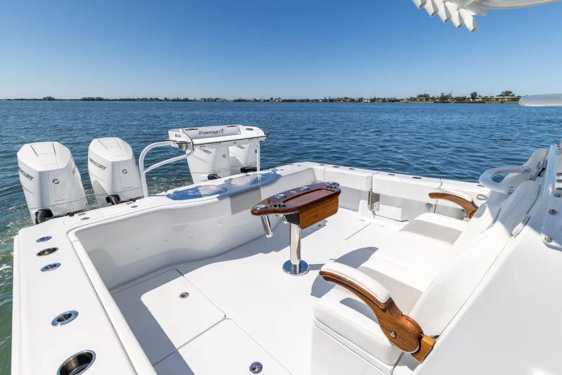 Slide: The Image of Freeman 43 boat, 2023 model, with dual engines on a sunny day at sea. - 23