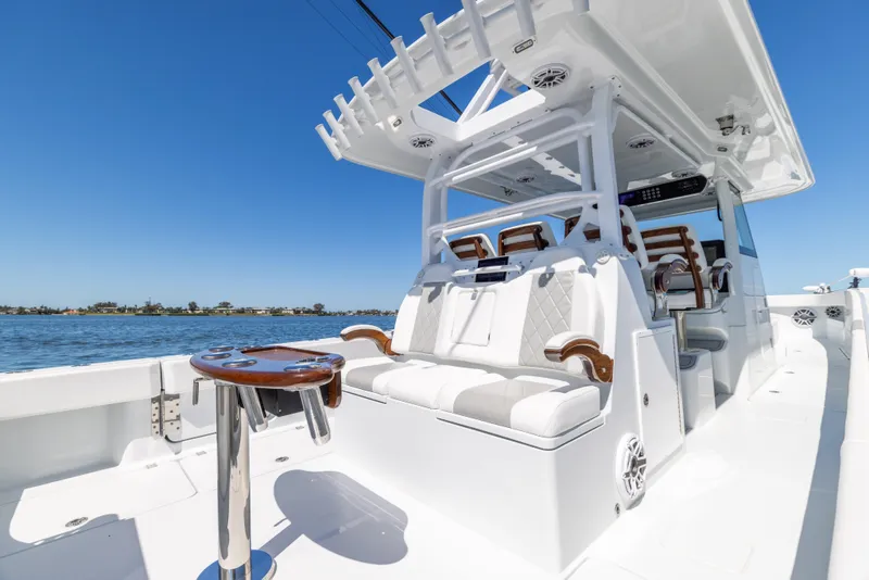 Slide: The Image of Luxurious 2023 Freeman 43 boat interior with plush seating and sleek design on open water. - 25