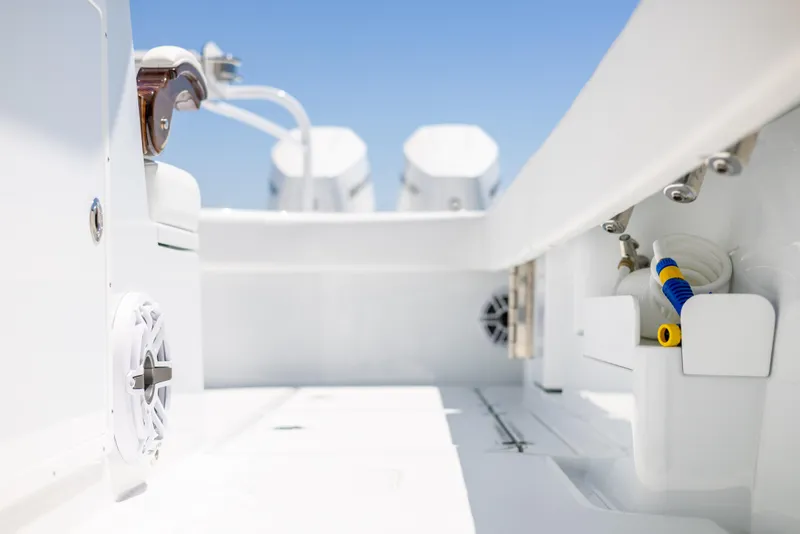 Slide: The Image of 2023 Freeman 43 boat interior with dual engines and marine equipment. - 29