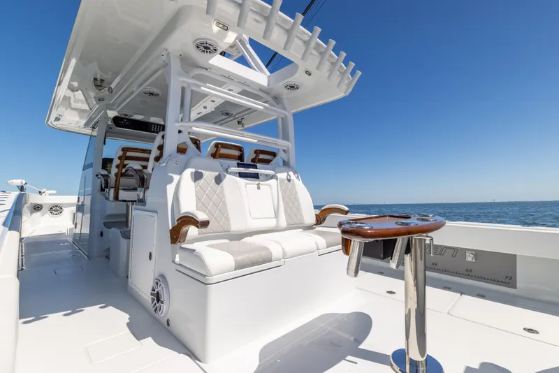 Slide: The Image of 2023 Freeman 43 boat interior with luxurious seating and ocean view. - 32