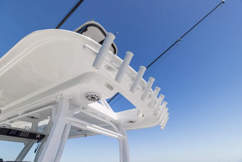 Slide: The Image of Freeman 43 boat, 2023 model, featuring rod holders against a clear blue sky. - 35