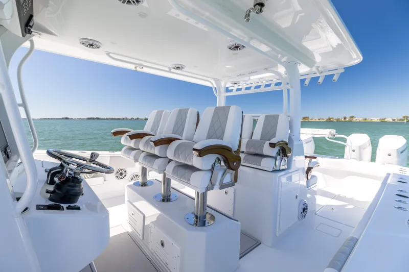 Slide: The Image of Luxurious 2023 Freeman 43 boat interior with plush seating and ocean view. - 38