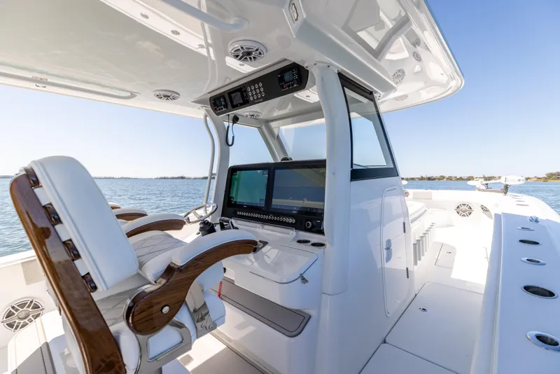 Slide: The Image of 2023 Freeman 43 boat interior with modern helm and seating on open water. - 39