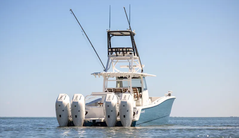 Slide: The Image of Freeman 43 boat, 2023 model, with four engines on open water. - 4