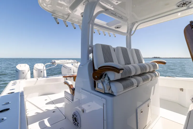 Slide: The Image of 2023 Freeman 43 boat interior with cushioned seating and ocean view. - 41