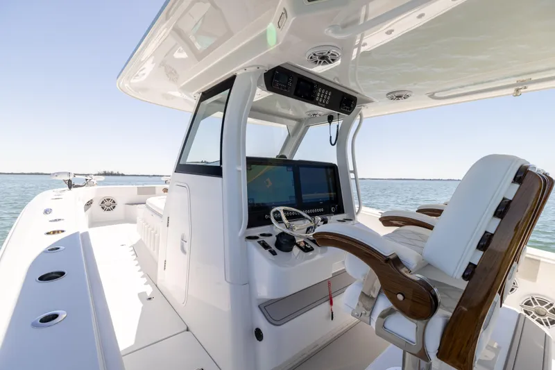 Slide: The Image of 2023 Freeman 43 boat interior with modern helm and seating on open water. - 42