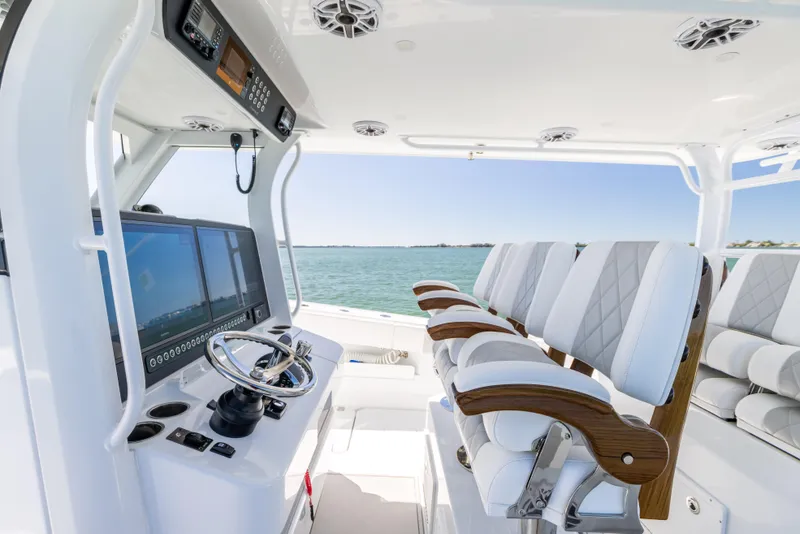Slide: The Image of Luxurious 2023 Freeman 43 boat interior with advanced navigation system and plush seating. - 45