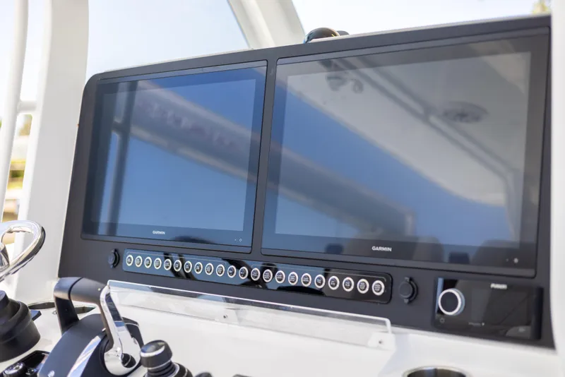 Slide: The Image of Freeman 43 boat dashboard with dual Garmin screens, 2023 model. - 47