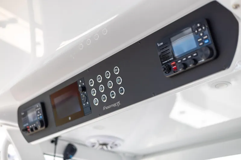 Slide: The Image of Freeman 43 boat dashboard with modern controls and displays, 2023 model. - 48