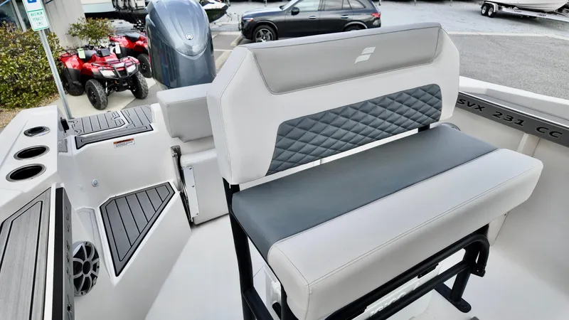 Slide: The Image of 2025 Starcraft SVX 231 OB CC boat interior with cushioned seating and modern design. - 8