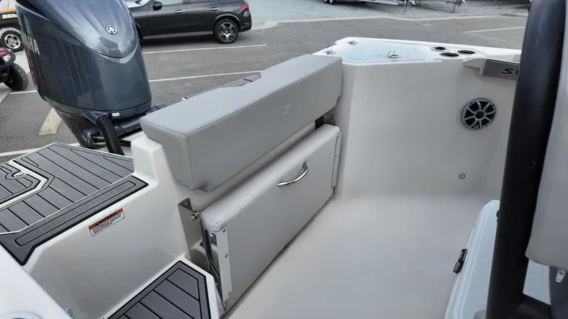 Slide: The Image of 2025 Starcraft SVX 231 OB CC boat interior with seating and storage. - 9