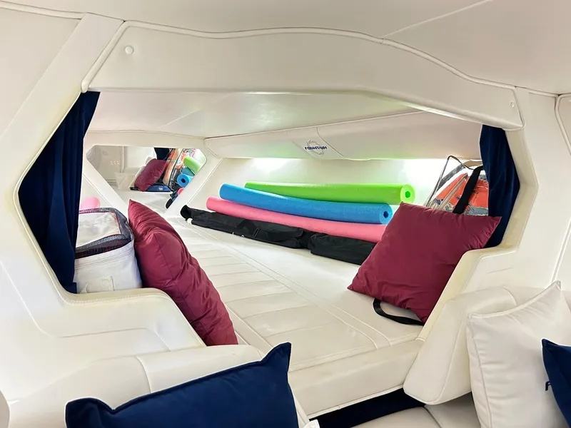 Slide: The Image of Interior of 2005 Fountain 42 Executioner boat with cushions and pool noodles. - 16