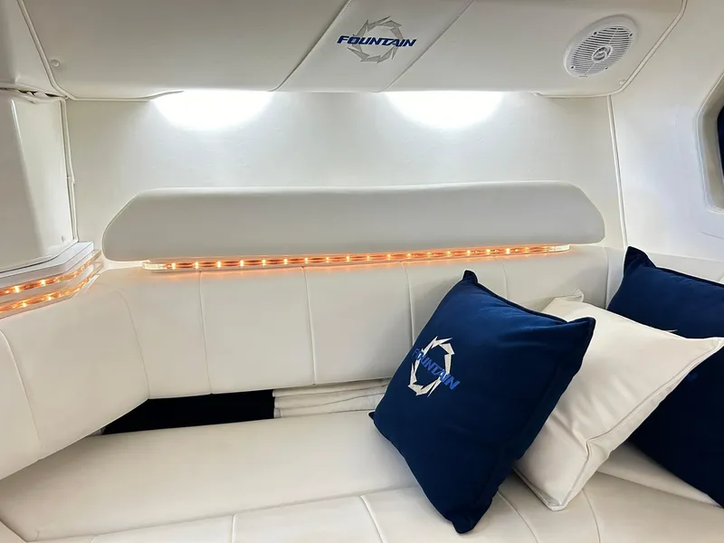 Slide: The Image of Luxurious interior of 2005 Fountain 42 Executioner boat with white seating and branded cushions. - 17
