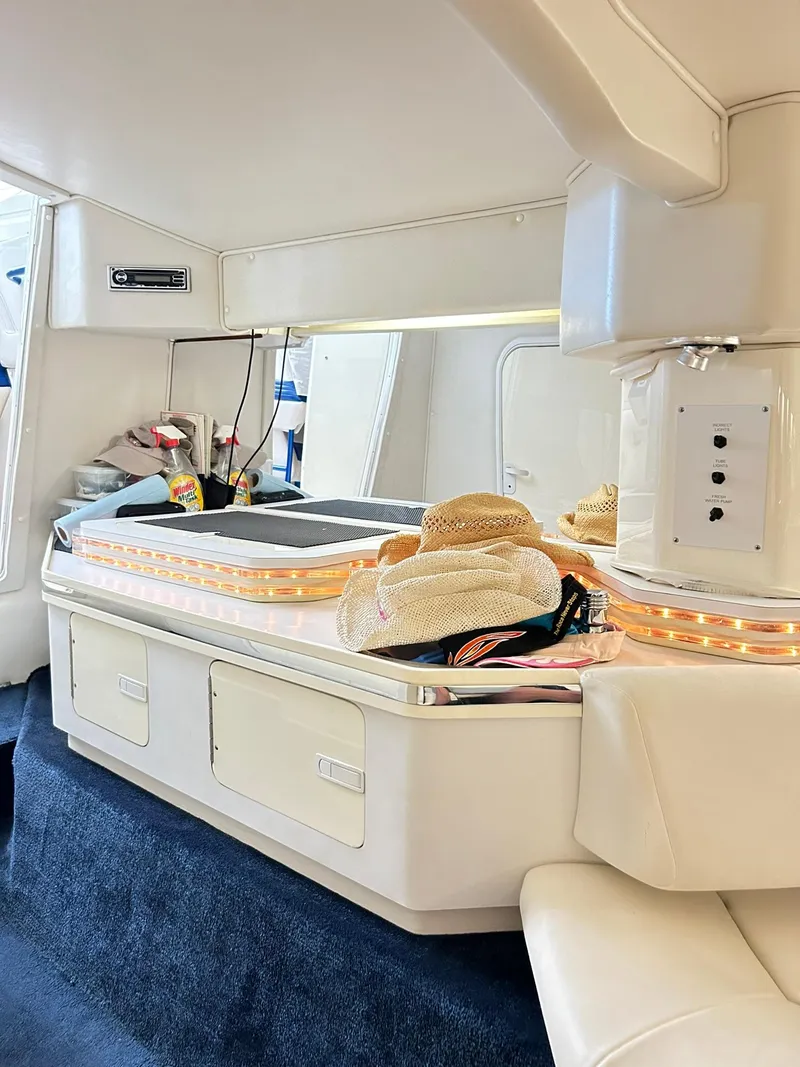 Slide: The Image of Interior of a 2005 Fountain 42 Executioner boat with hats and storage. - 18