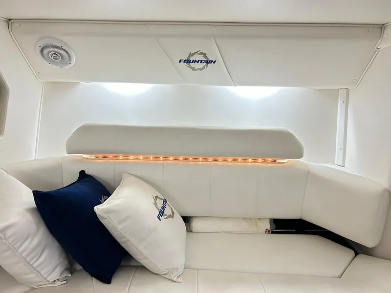 Slide: The Image of Interior of 2005 Fountain 42 Executioner boat with white seating and branded cushions. - 19
