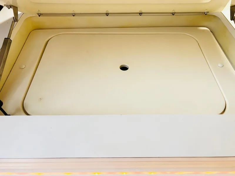 Slide: The Image of Open storage compartment on a 2005 Fountain 42 Executioner boat. - 20