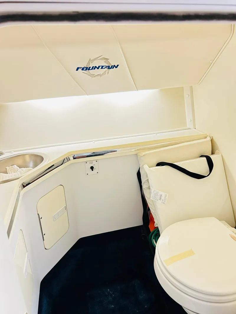 Slide: The Image of 2005 Fountain 42 Executioner boat interior with toilet and sink. - 22