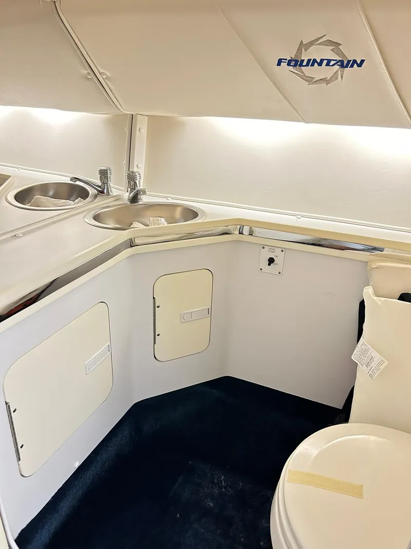 Slide: The Image of 2005 Fountain 42 Executioner boat interior with sink and storage compartments. - 23