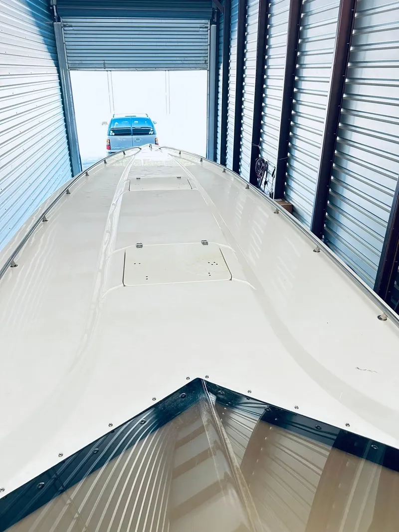 Slide: The Image of 2005 Fountain 42 Executioner boat stored in a garage, viewed from the bow. - 25