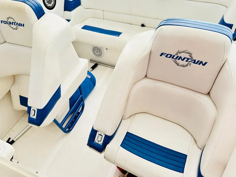Slide: The Image of 2005 Fountain 42 Executioner boat interior with white and blue seating. - 27